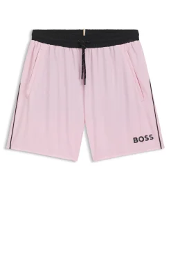 Badeshorts mit kontrastfarbenem Logo und Paspelierung