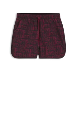 Badeshorts mit saisonalem Print und abgerundetem Saum