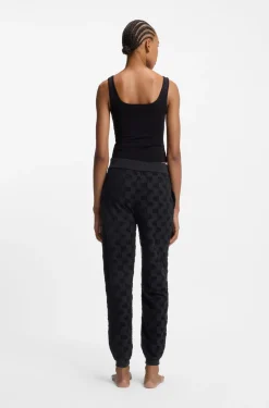 Jogginghose aus Baumwoll-Mix mit Allover-Logo-Muster