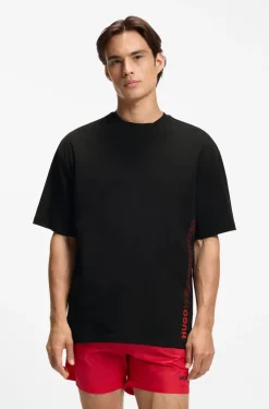 Oversized-Fit T-Shirt aus Baumwolle mit fortlaufendem Logo-Print