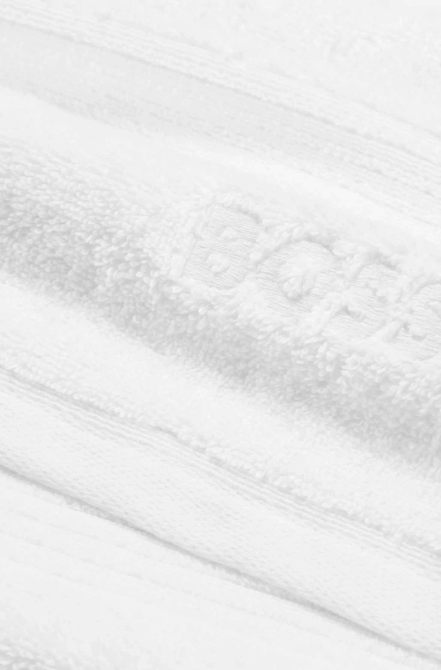 Weiße Badematte aus Baumwolle mit gesticktem Logo